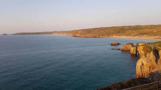 Perranporth Cliffs and Ligger Point far away at sunset