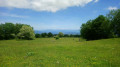 Panorama de Beauregard et Combe Danoi à travers champs ouverts et chemins