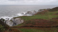 cliffs next to Rockham Beach and Bull Point far away