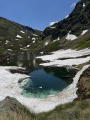 Glacier melting into the blue pond