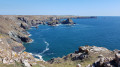 Kynance Cove and Lizard village far away