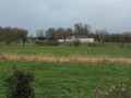 La ferme de Vauculey vue depuis le chemin du Ricaras