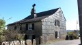 Maison typique de bardeaux et toit en ardoises