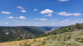 Paysage en direction de Bassy, que l'on devine cach&eacute; contre un rocher