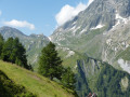 Petit Col Ferret, centre, with snow patches leading up to it.