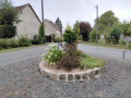 Flower-filled roundabout at Les &Eacute;pineraises
