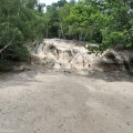 Sandstone outcrop and 'beach' below it, in Rackham