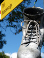 Silver boot and yellow sign at the start of the walk