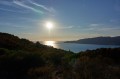 Soleil couchant sur le golfe de Cupabia et la tour de Capanella