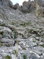 Steep rocky ground on the descent into Combe des Andins, rope handrail and metal staples